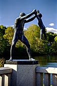 Oslo, Norway. Vigeland Park. Sculptures of the bridge, Man swinging a boy. 